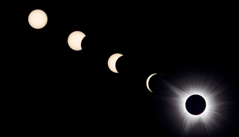 Three images showing the progress of a solar eclipse as the Moon covers the Sun