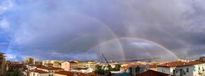 A composite showing four rainbows. Each is centred on different points