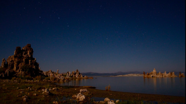 The Big Dipper sinks in the sky with the handle sweeping out a larger circle than the bowl of the asterism.