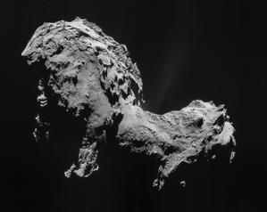 This comet nucleus looks like two large, bumpy lumps joined together. A small jet of material is being blown off the nucleus