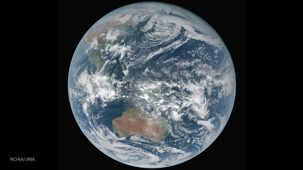 The Earth from space showing swirling clouds, oceans and continents