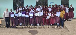 Elineema and Matthias with a group of Tanzanian school students