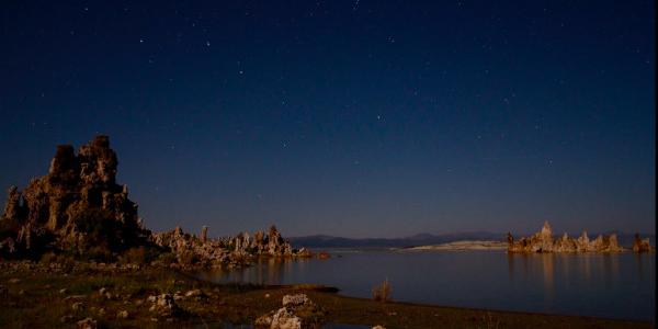 The Big Dipper sinks in the sky with the handle sweeping out a larger circle than the bowl of the asterism.