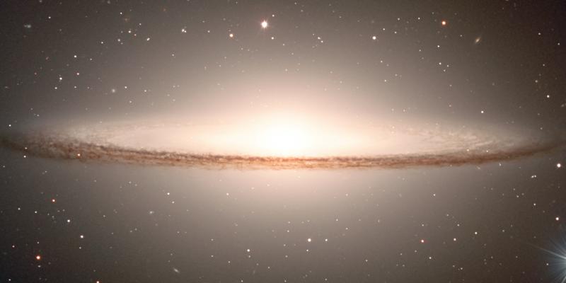 This galaxy has a large bulge surrounded by a ring of dust creating an image similar to the mexican hat with the same name