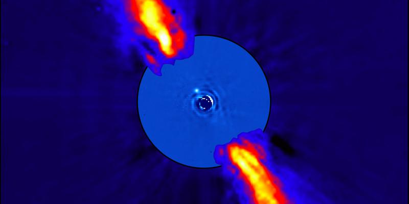 Il pianeta beta Pictoris b è un punto luminoso vicino alla stella madre, circondato da un disco caldo visto di profilo.