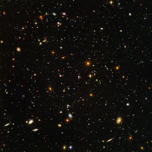 The Hubble Ultra Deep Field showing around 10,000 galaxies of various ages, sizes, shapes and colours.