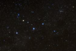 Five bright stars form the shape of the letter M.